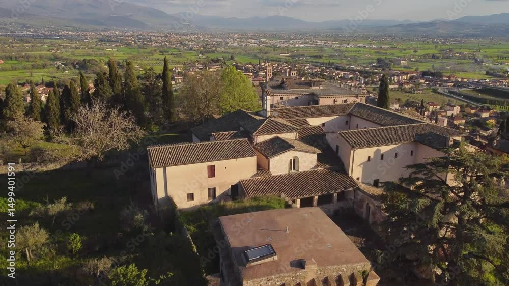 Rising aerial view of Spello's village, Umbria, Italy, clear sky, drone, 4k Rising aerial view of Spello's village, Umbria, Italy, clear sky, drone, 4k