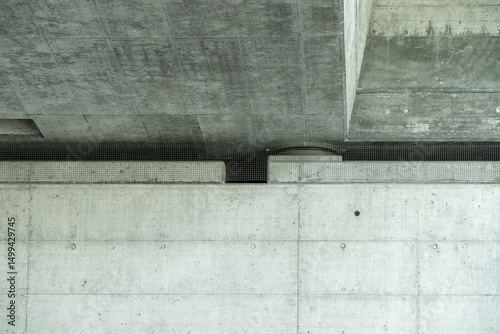 View on bridge construction from under the bridge with concrete elements and grid to prevent animals to contaminate it.