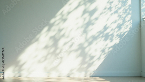 Wallpaper Mural Shadows of Serenity: The play of sunlight and shadow dances across a pristine wall, conjuring a sense of peace and tranquility. The light creates an ethereal pattern. Torontodigital.ca
