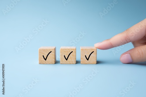 Hand Placing Checked Wooden Cubes, Selection and Decision Concept with Blue Background.