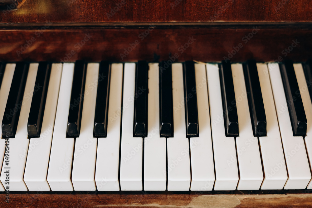 Close-up view of piano keys showcasing the beauty of a classic instrument Close-up view of piano keys showcasing the beauty of a classic instrument