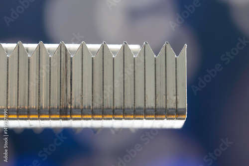 Macro side view of silver coloured office staples