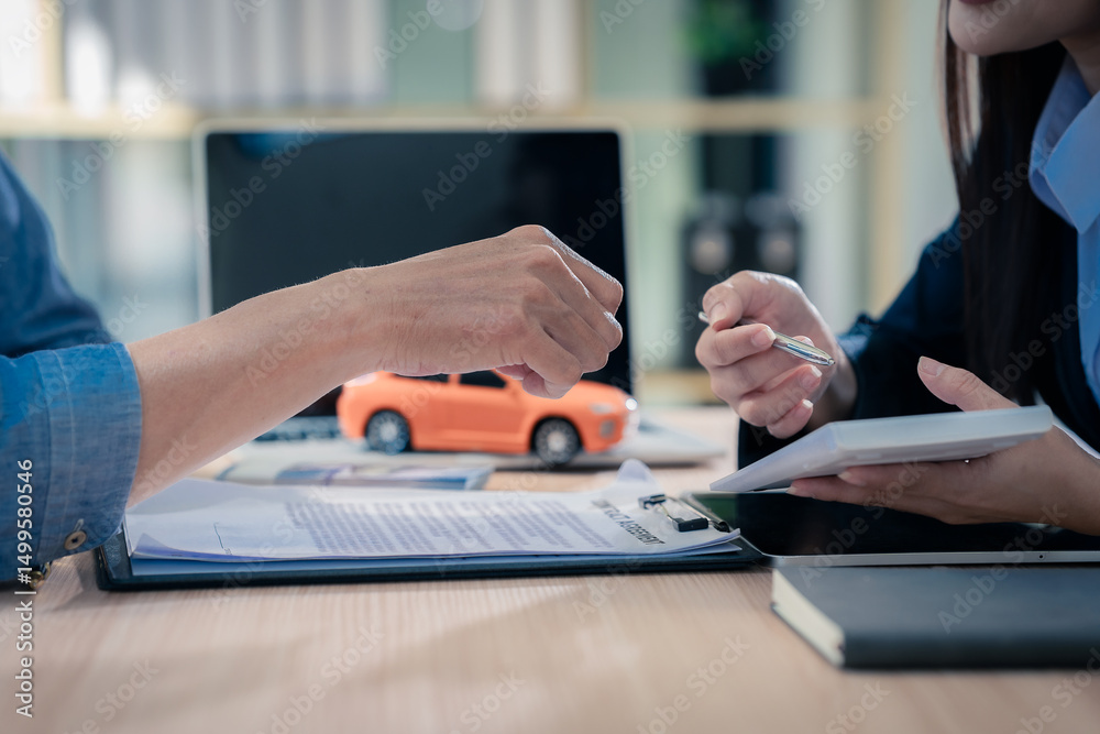 Fototapeta premium Car dealer and customer are signing loan, insurance and investment contract. Car sales concept. Close up.