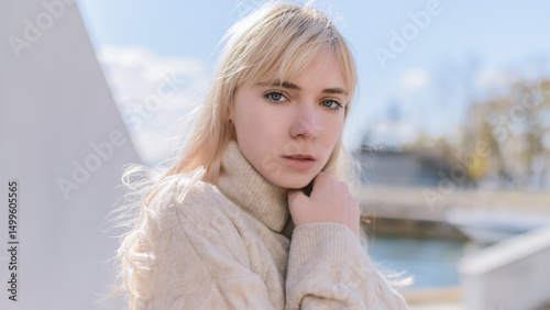 Portrait of young woman at sunny day.