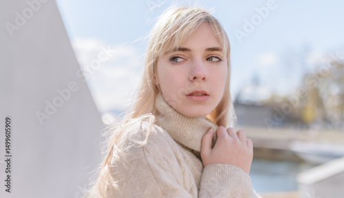 Portrait of young woman at sunny day.