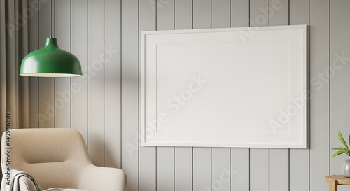 Cozy upholstered armchair with green pendant lamp and blank picture frame on modern panel wall in bright living room interior