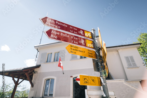 Close up shot of hiking and bike trail signs signalling which direction to go 