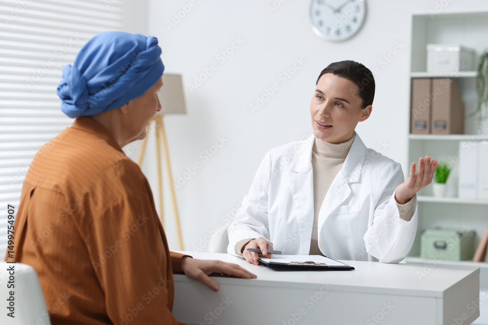 Senior woman with cancer visiting oncologist in clinic Senior woman with cancer visiting oncologist in clinic