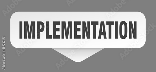 implementation sticker. implementation sign isolated on gray background