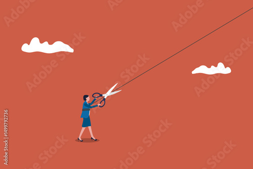 Business woman using scissor to cut the strings attached to her body