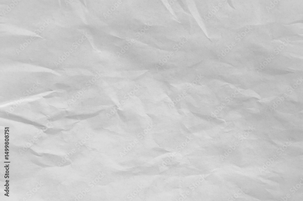 Fototapeta premium Crumpled white paper forming an abstract textured background