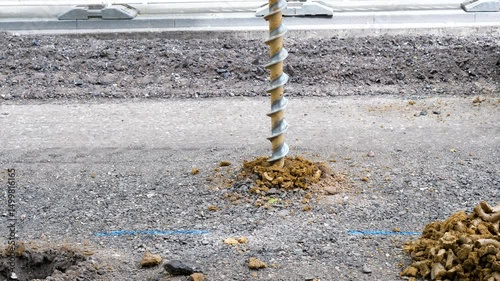 Drilling holes into the road surface - construction site