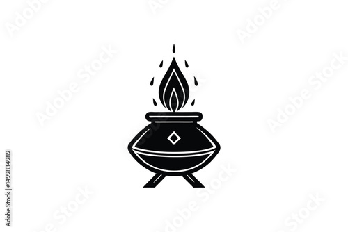 Mystical cauldron silhouette with burning flame