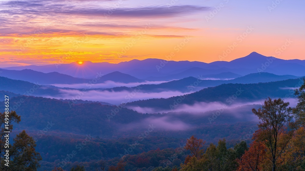 Obraz premium Golden sunset over a serene landscape, warm light through clouds, orange and purple hues blending in harmony