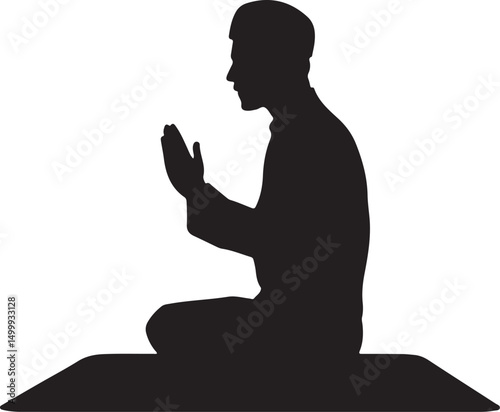 Silhouette of a Muslim man praying on a mat