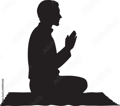 Silhouette of a Muslim man praying on a mat