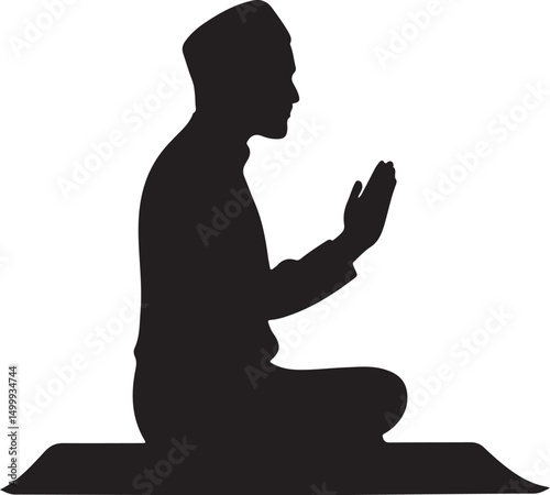 Silhouette of a Muslim man praying on a mat