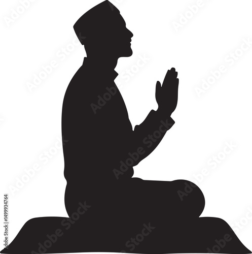 Silhouette of a Muslim man praying on a mat