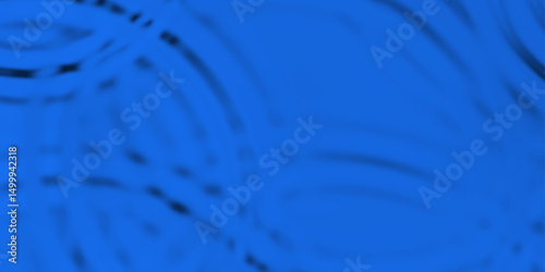 Circles on blue water surface from above, abstract background. macro of circular waves on a water surface, caused by a falling water drop. A droplet of water dispersing on a blue surface. 