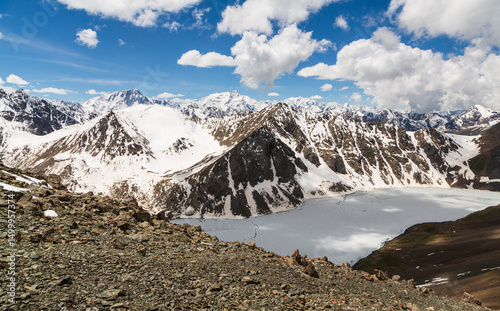 Aerial panoramic view over the frozen  lake Ala-Kul from mountain pass. Tien Shan. Kyrgyzstan photo