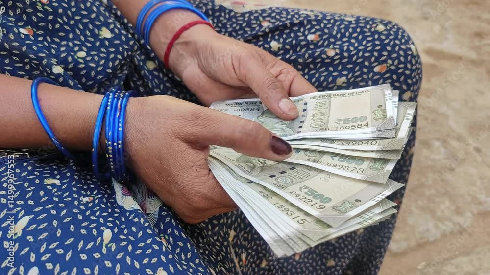 Indian female counting 500 rupees Indian currency notes