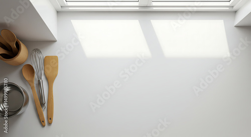 Bright kitchen scene featuring wooden utensils against a white backdrop, conveying cleanliness