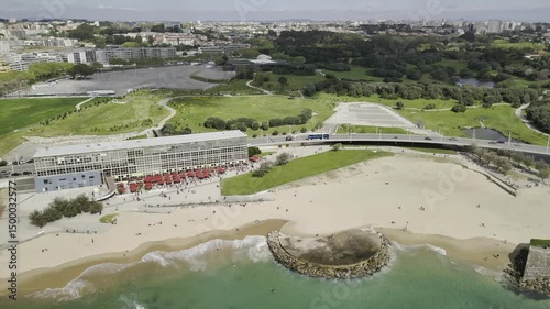 Drone flies to the right along the Praia de Matosinhos beach toward the Castelo do Queijo, Forte de São Francisco Xavier in Porto, Portugal