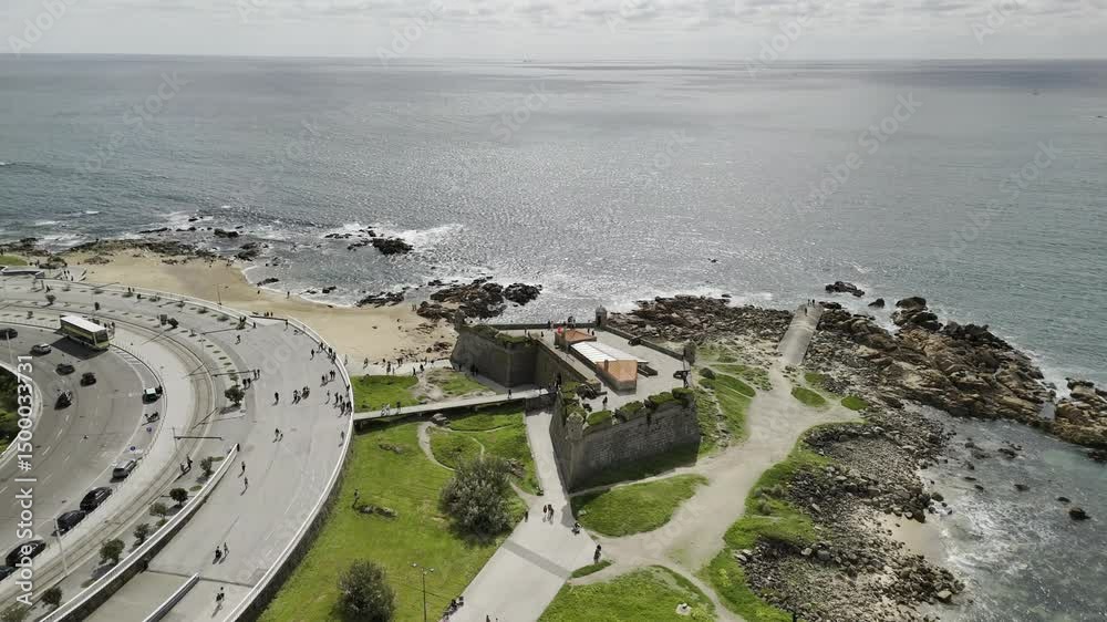 Drone orbits from back to front of Castelo do Queijo,
Forte de São Francisco Xavier on sunny day in Porto, Portugal