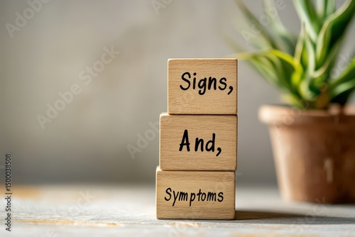 Wooden blocks stacked showing signs and symptoms