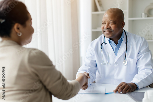 Meeting In Clinic. Smiling Black Therapist Man Shaking Hands With Female Patient, Friendly Doctor Man In Uniform Handshaking With Young Woman, Greeting On Medical Consultation, Selective Focus