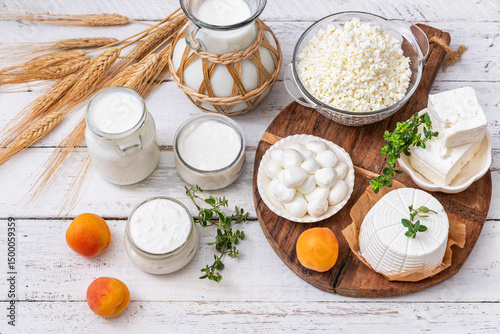 Fresh dairy products, milk, cottage cheese,  yogurt, kefir, feta cheese on kitchen table