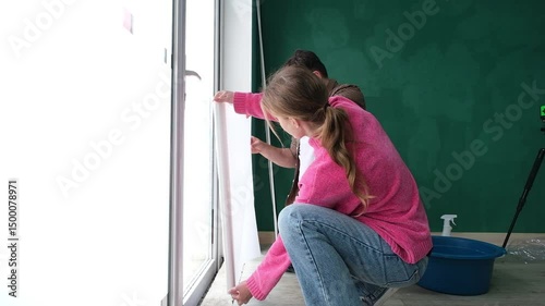a couple toning windows and doors glass at home using toning film. home improvement
