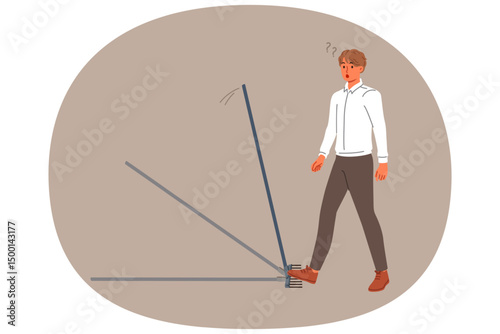 Business man steps on rake, risking injury, for concept of bankruptcy due to mistake. Stupid guy makes mistake, needing to improve intellectual and professional knowledge of problem solving