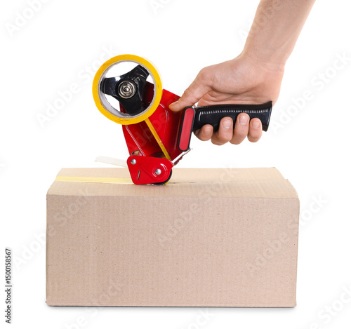 Man using dispenser with adhesive tape to seal cardboard box on white background, closeup