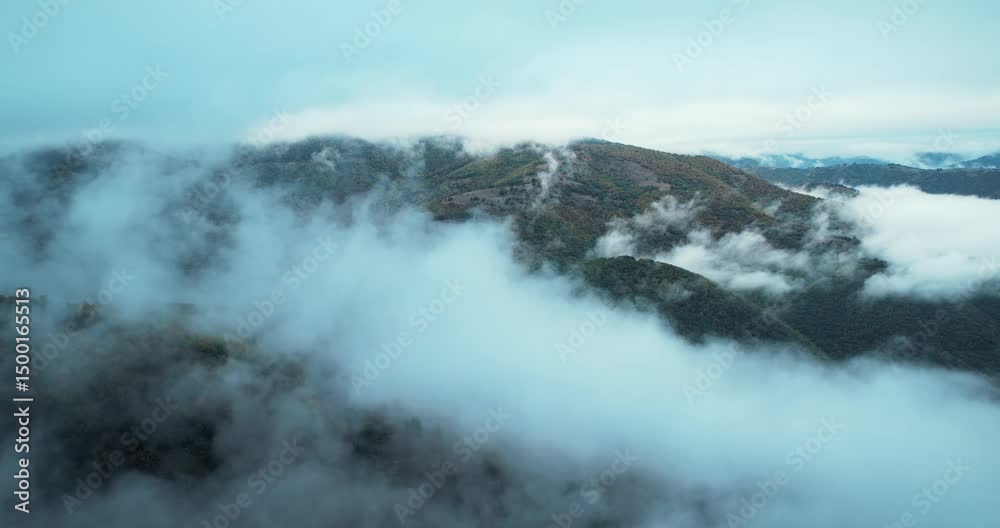Majestic Mountain Range Shrouded in Thick Mist and Low-Lying Clouds Majestic Mountain Range Shrouded in Thick Mist and Low-Lying Clouds