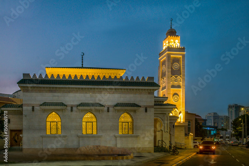 Awesome  view on Mosque in Abu Dhabi  -  yellow elecrtric lights and blue sky of dusk