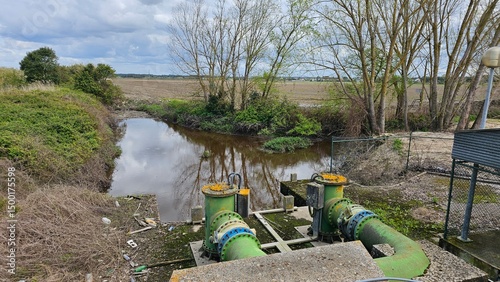 Irrigation Pumping Station with Industrial Pipes near River – Rural Water Management Infrastructure