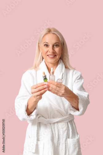 Mature woman in bathrobe ho...