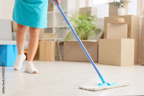 Female janitor mopping floo...