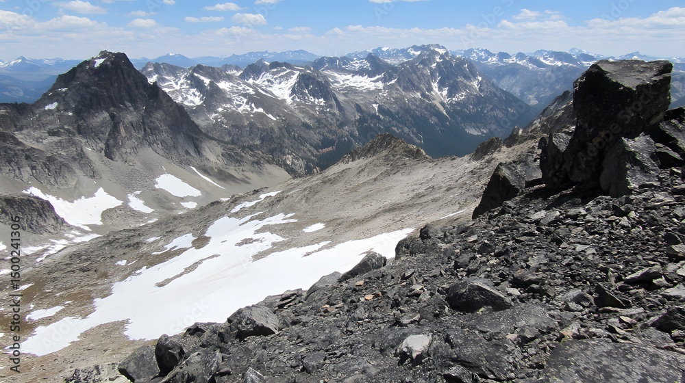 Fototapeta premium Majestic Mountain Peak Panorama: Snow-Covered Peaks and Rocky Terrain