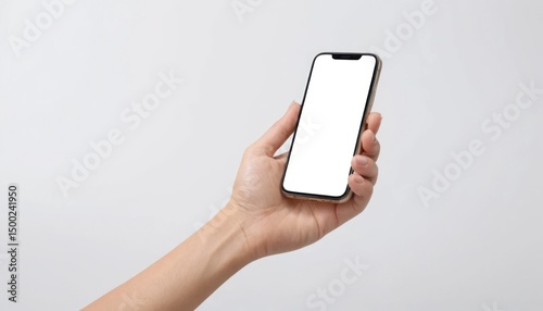 A woman's hand holds a blank smartphone, a digital device for wireless communication and business