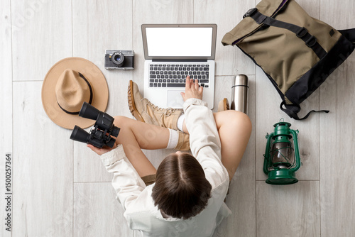 Female traveler using lapto...