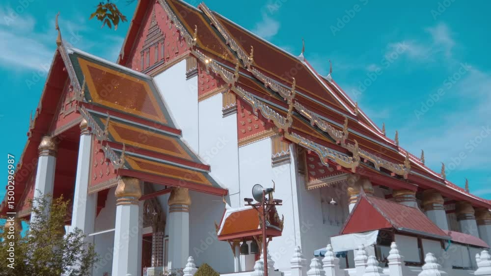 Exterior of magnificent Buddhist temple Wiharn Phra Mongkhon Bophit in Ayutthaya known for its massive, gilded statue of the sitting Buddha. Shot in motion