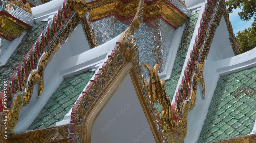 Amazing golden carved roofs a colorful traditional Thai style temple in King Rama Public Park in Ayutthaya, Thailand. Shot in motion