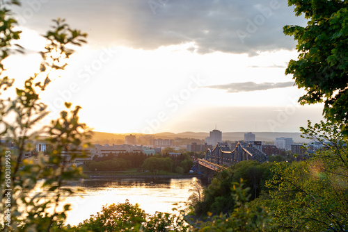 Ottawa River during sunset. View on Alexandra bridge and Gatineau city in Canada