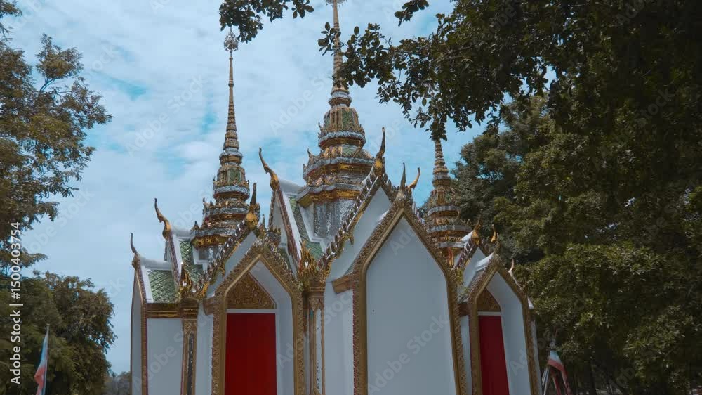 Colorful traditional Thai style temple in King Rama Public Park in Ayutthaya, Thailand. Shot in motion