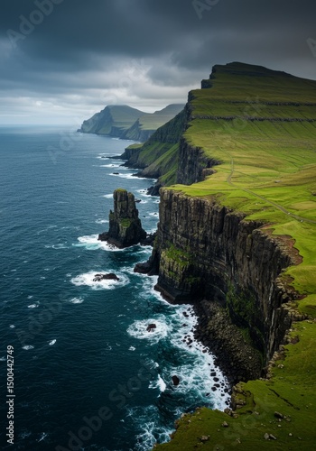 Dramatic Coastal Landscape Photo of Cliffside and Azure Sea in Cloudy Weather