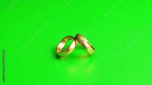 elegant gold wedding rings resting on a vibrant green background ideal for romance themes love marriage proposals and anniversary celebrations








