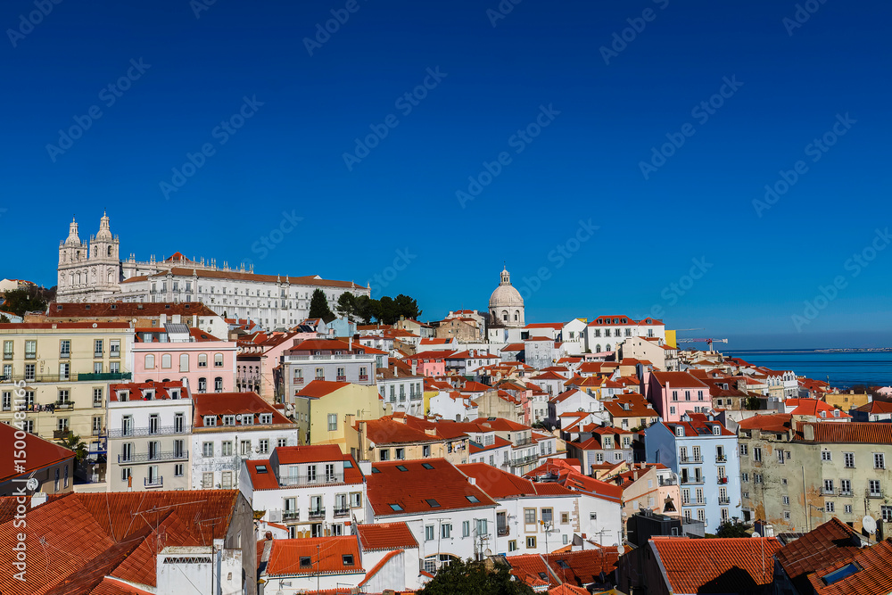 Fototapeta premium The Portas do Sol Viewpoint , Ancient monastery of Sao Vicente de Fora iin the background , Lisbon, Portugal