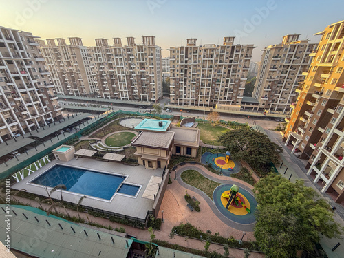 A view of a residential area with a pool and a playground